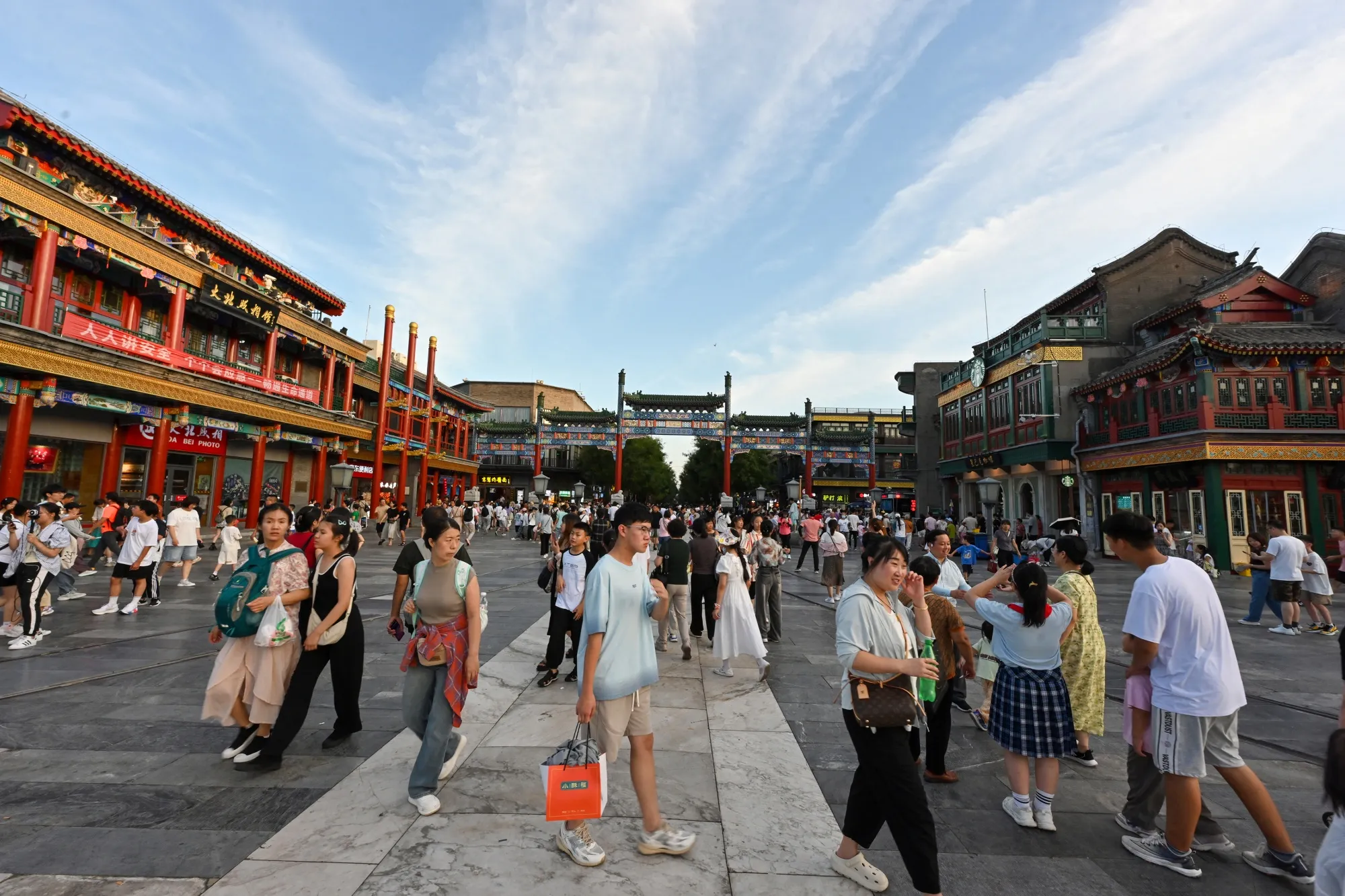 People visit Qianmen Street in Beijing.