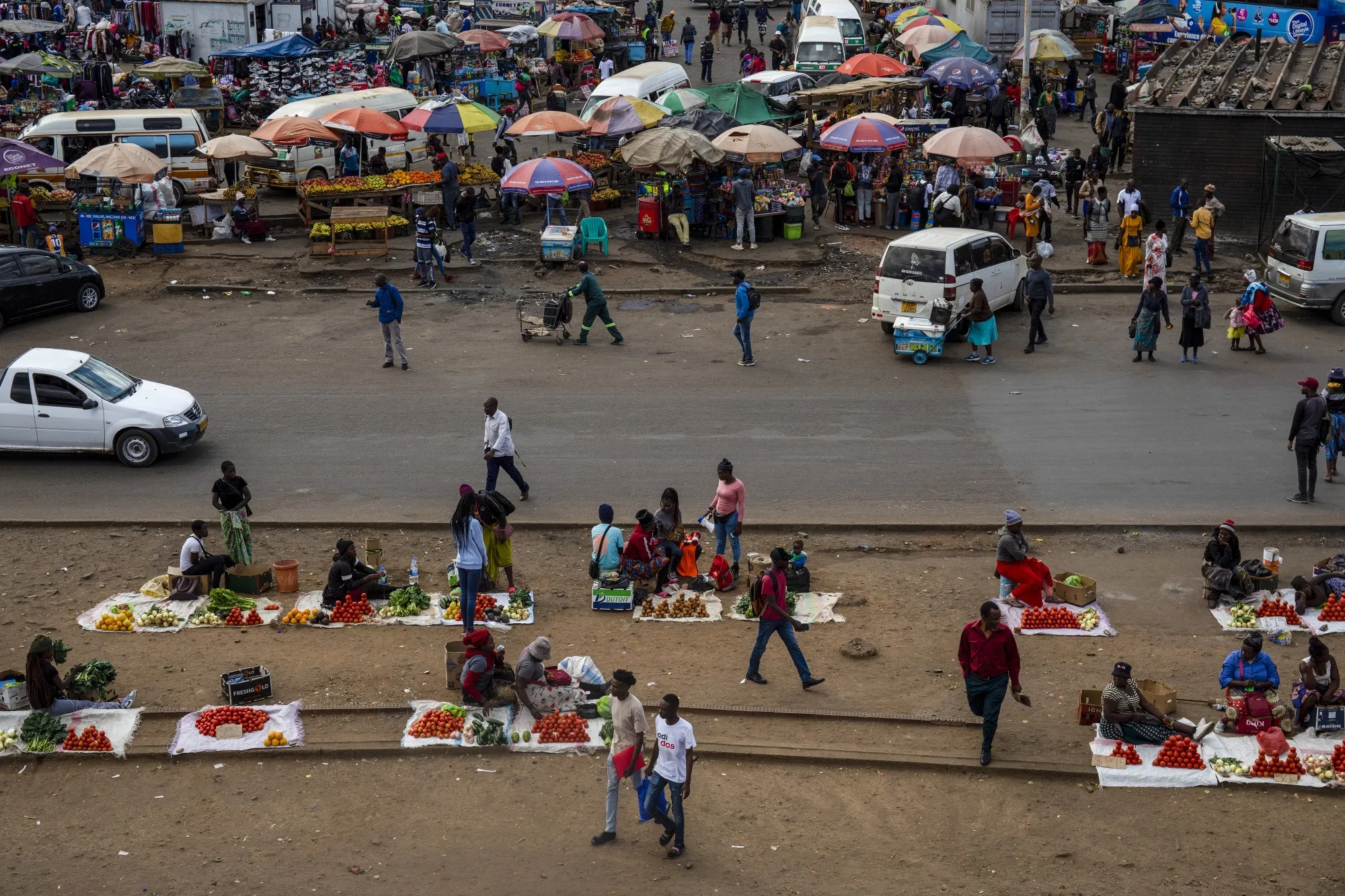 Street vendors at the bus terminus in the central business district of Harare, Zimbabwe.