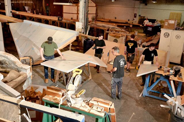 Journeymen carpenters work on Act 3.