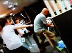 In this screen shot of a surveillance video, women reportedly ordered Zhang Lidong, right, to kill a woman at a McDonald's restaurant in &nbsp;Shandong province.