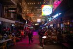 Customers at the outside seating areas of bars and restaurants in the Patpong entertainment district of Bangkok.