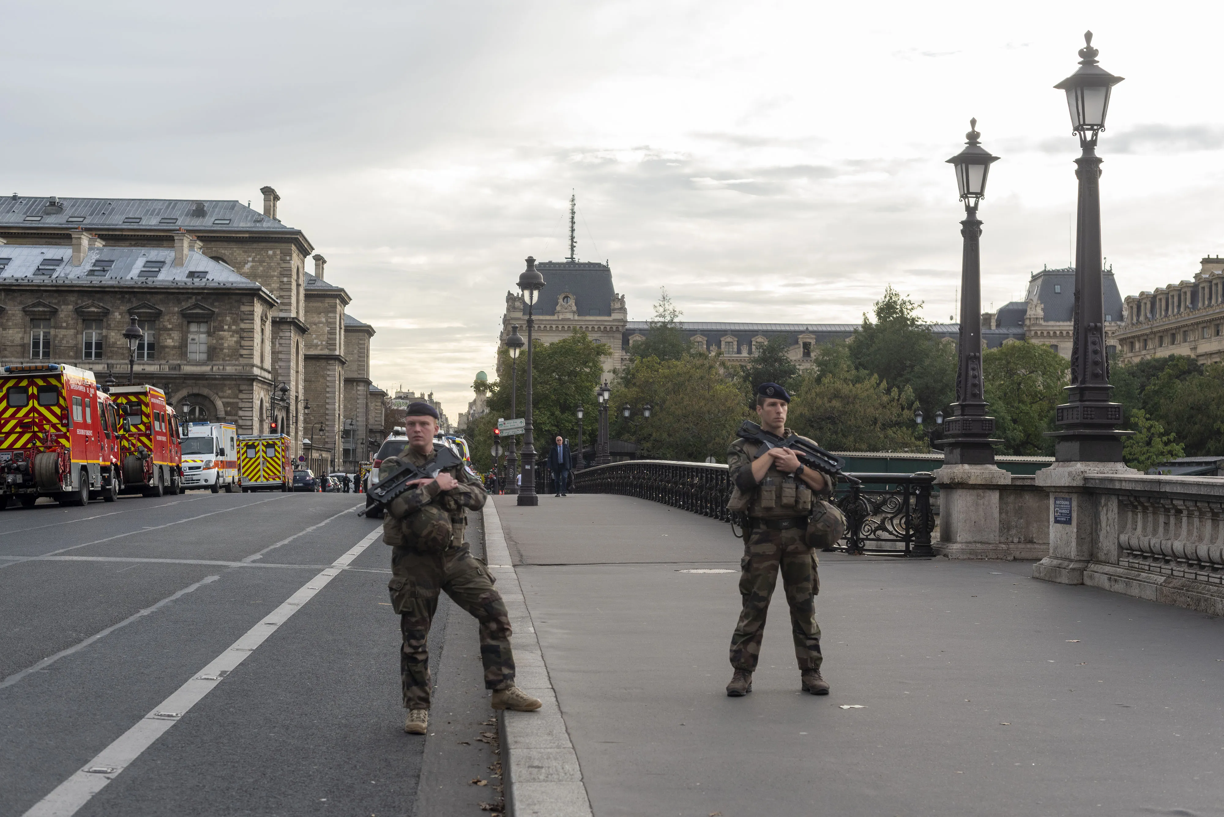 Armed soldiers stand guard on the closed Notre Dame bridge following an attack at the central Paris police headquarters in Paris.&nbsp;