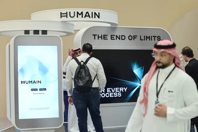 Image: Guests stand at the booth of Saudi artificial intelligence company Humain during the Future Investment Initiative conference in Riyadh, Saudi Arabia on Oct. 29.