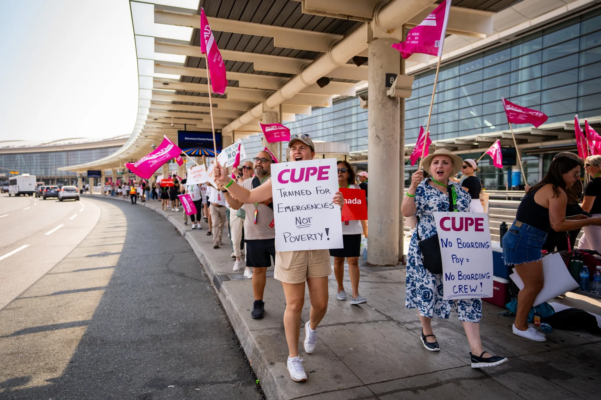 Air Canada flight attendants and supporters during a strike at Toronto Pearson International Airport on Aug. 16.