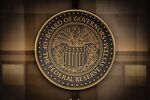 The seal of the U.S. Federal Reserve Board of Governors across the street from the Federal Reserve building.