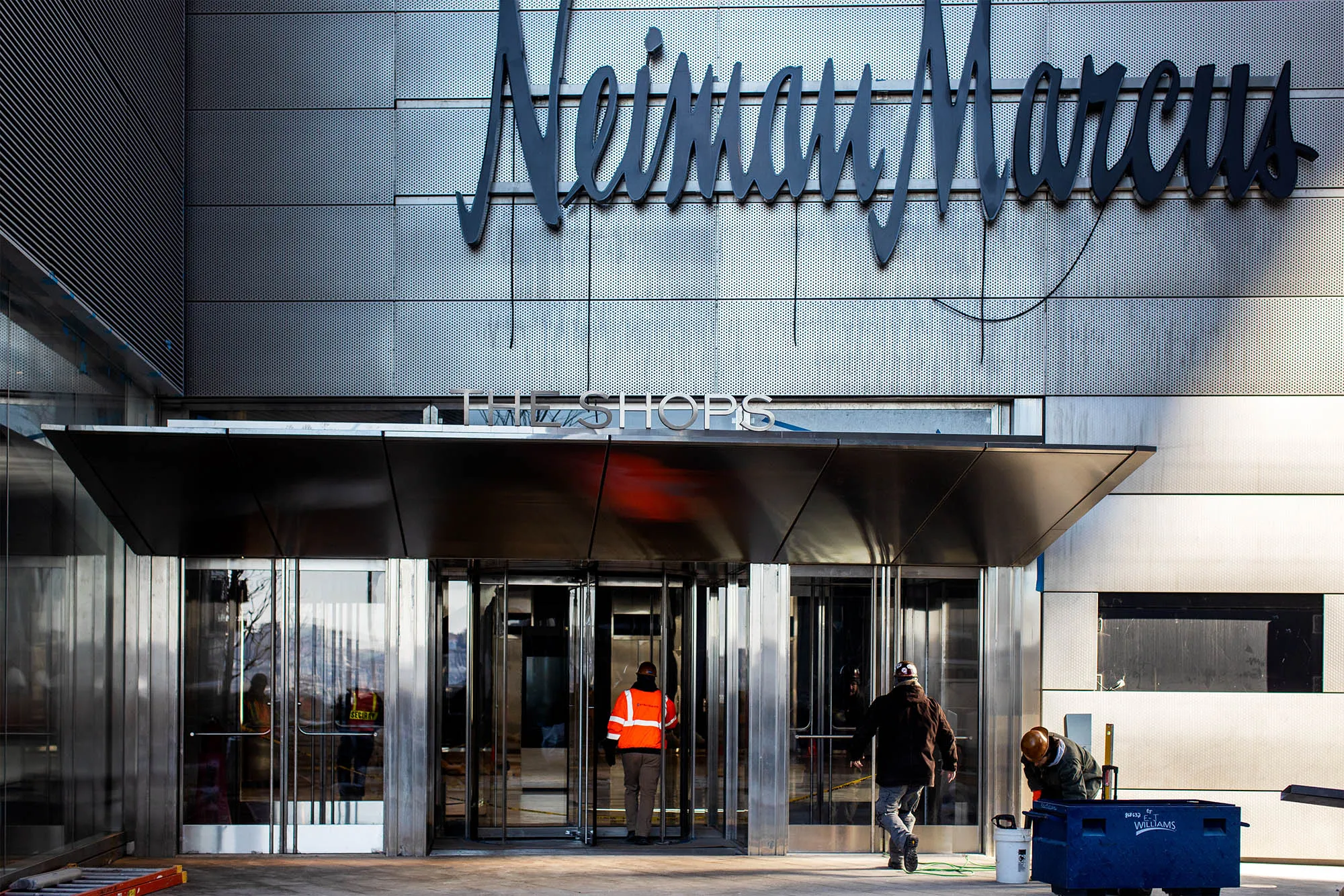 A contractor enters the Neiman Marcus store at the Hudson Yards development in New York.