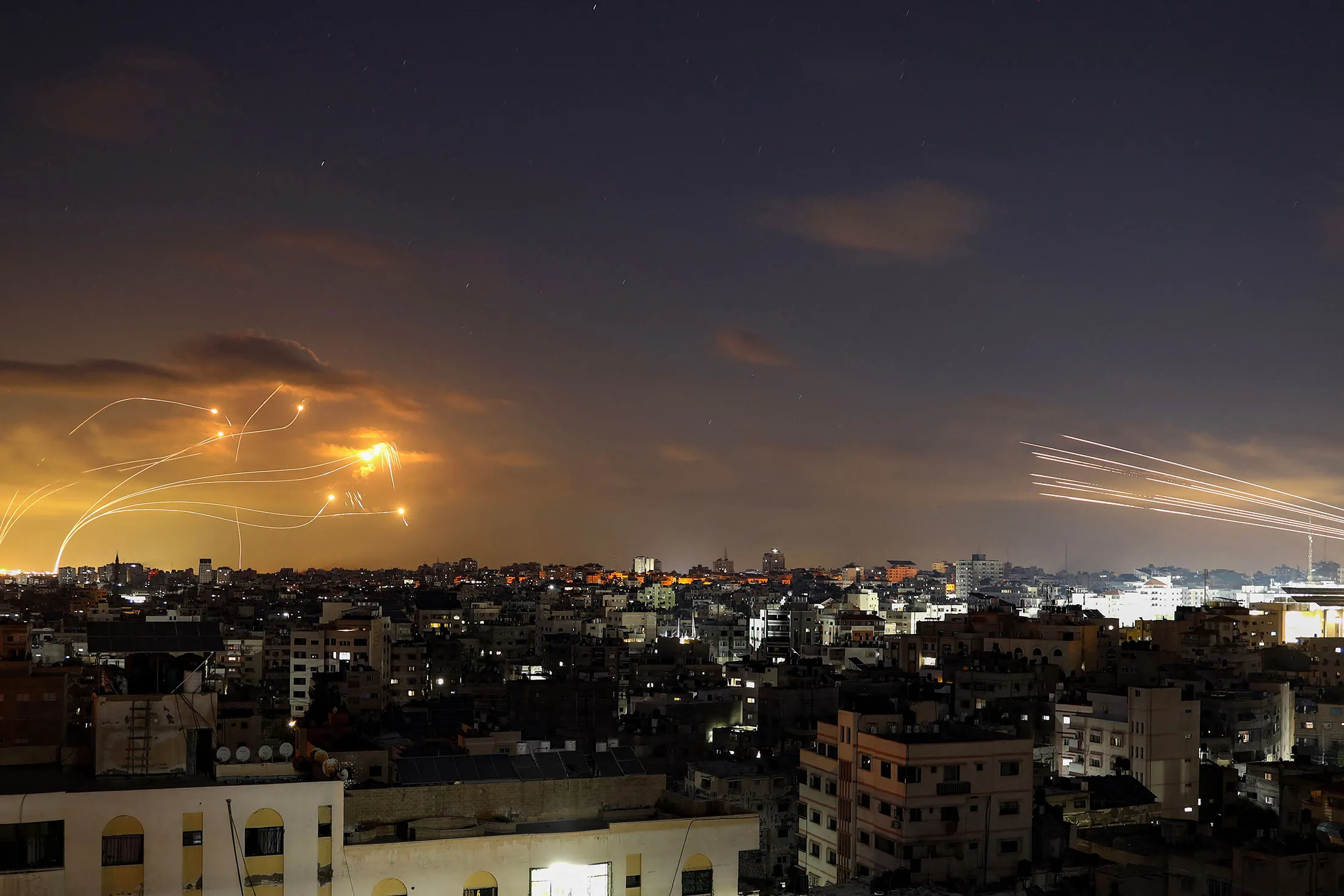 Rockets fired from Gaza, right,&nbsp;being intercepted by Israel's Iron Dome defense missile system&nbsp;on Oct.&nbsp;10.