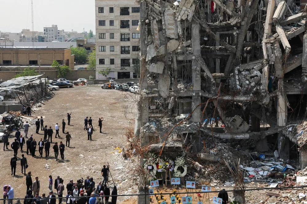 People&nbsp;view damage at sites targeted by airstrikes&nbsp;in Tehran on April 20.&nbsp;