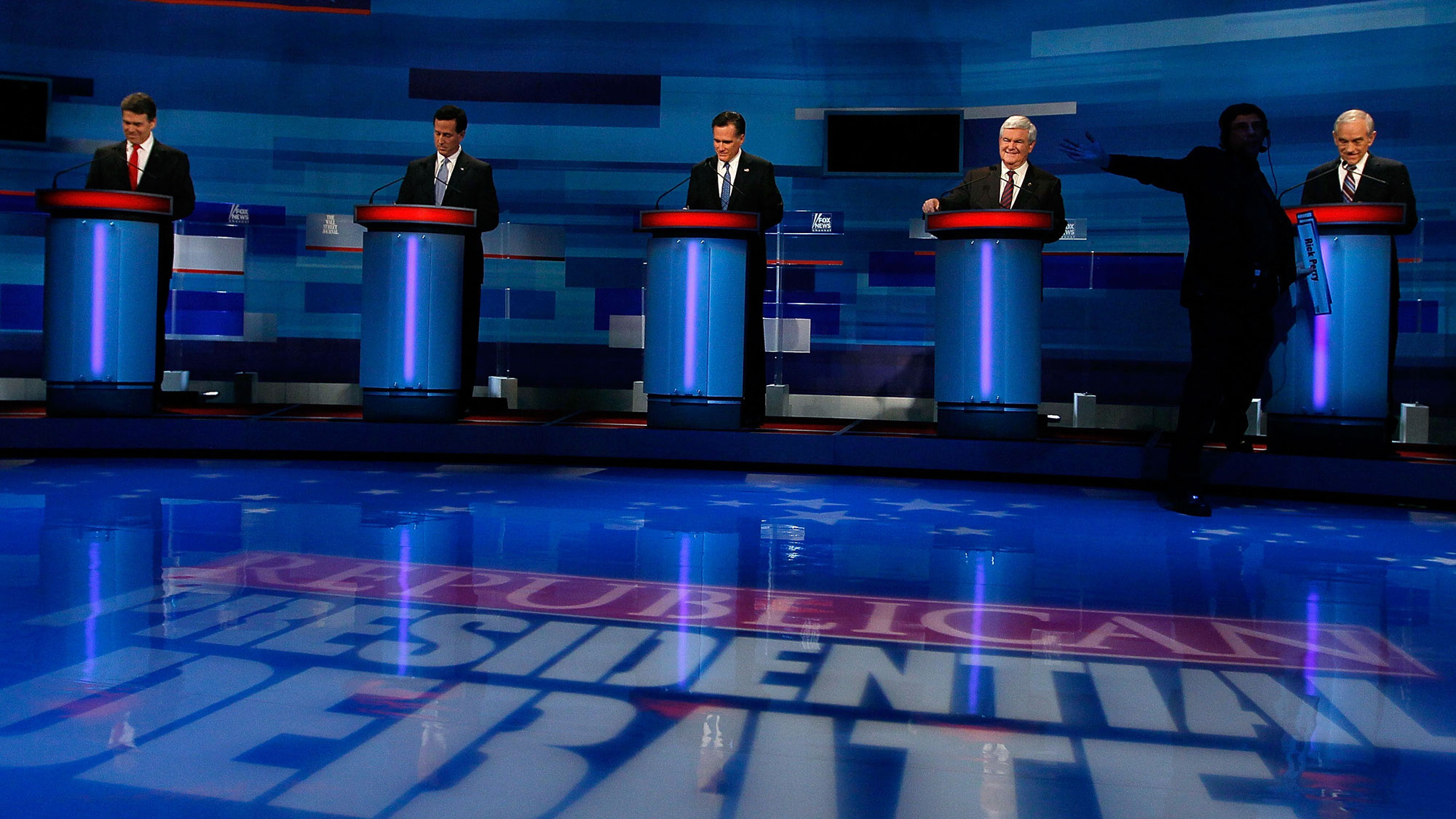Republican presidential candidates (L-R) Texas Gov. Rick Perry, former U.S. Sen. Rick Santorum of Pennsylvania, former Massachusetts Gov. Mitt Romney, former U.S. House Speaker Newt Gingrich and U.S. Rep. Ron Paul (R-TX) look over their notes before participating in a Fox News, Wall Street Journal sponsored debate at the Myrtle Beach Convention Center on January 16, 2012 in Myrtle Beach, South Carolina.
