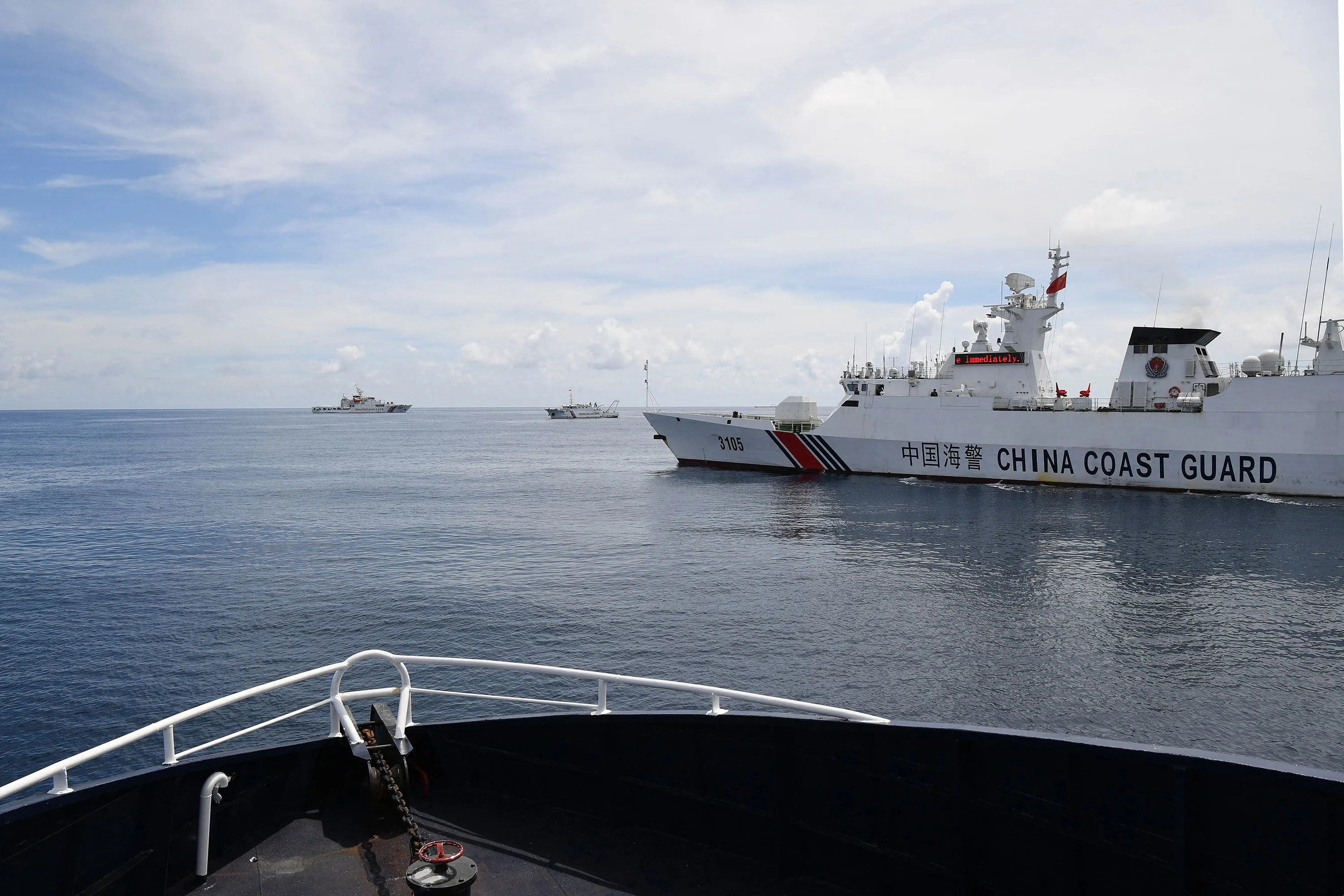 A Chinese coast guard ship&nbsp;blocks a Philippine Bureau of Fisheries and Aquatic Resources vessel&nbsp;near the entrance of the Scarborough Shoal in the disputed South China Sea.