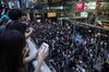 Demonstrators gather in the Tsim Sha Tsui district of Hong Kong on Sunday.