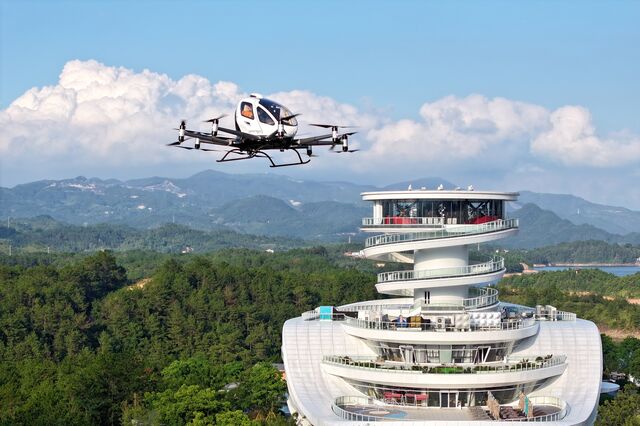 Tourists ride Ehang's EH216-S at Tianding Lake International Tourism Resort, in China, in July 2024.