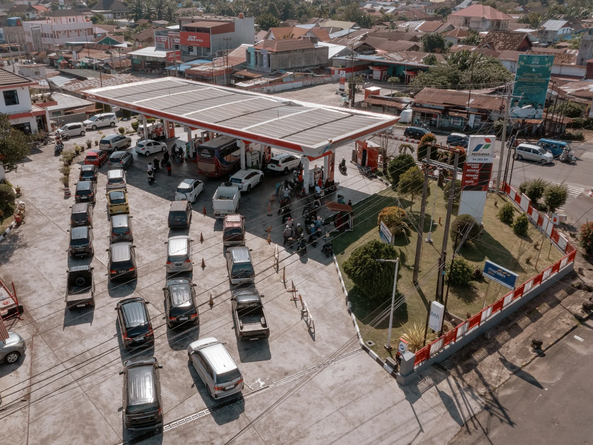 Vehicles in a queue at a gas station in Bengkulu, Indonesia.
