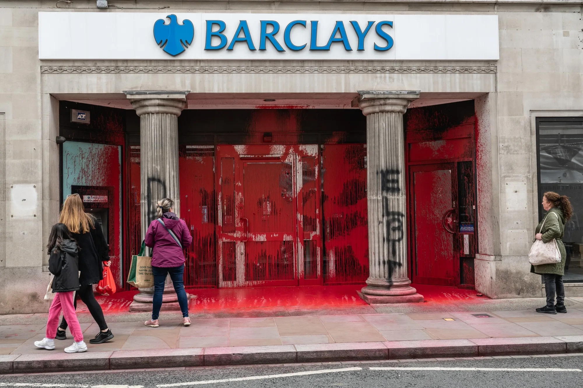 Paint covers the entrance to a Barclay's bank branch in Richmond, UK, on June 10.
