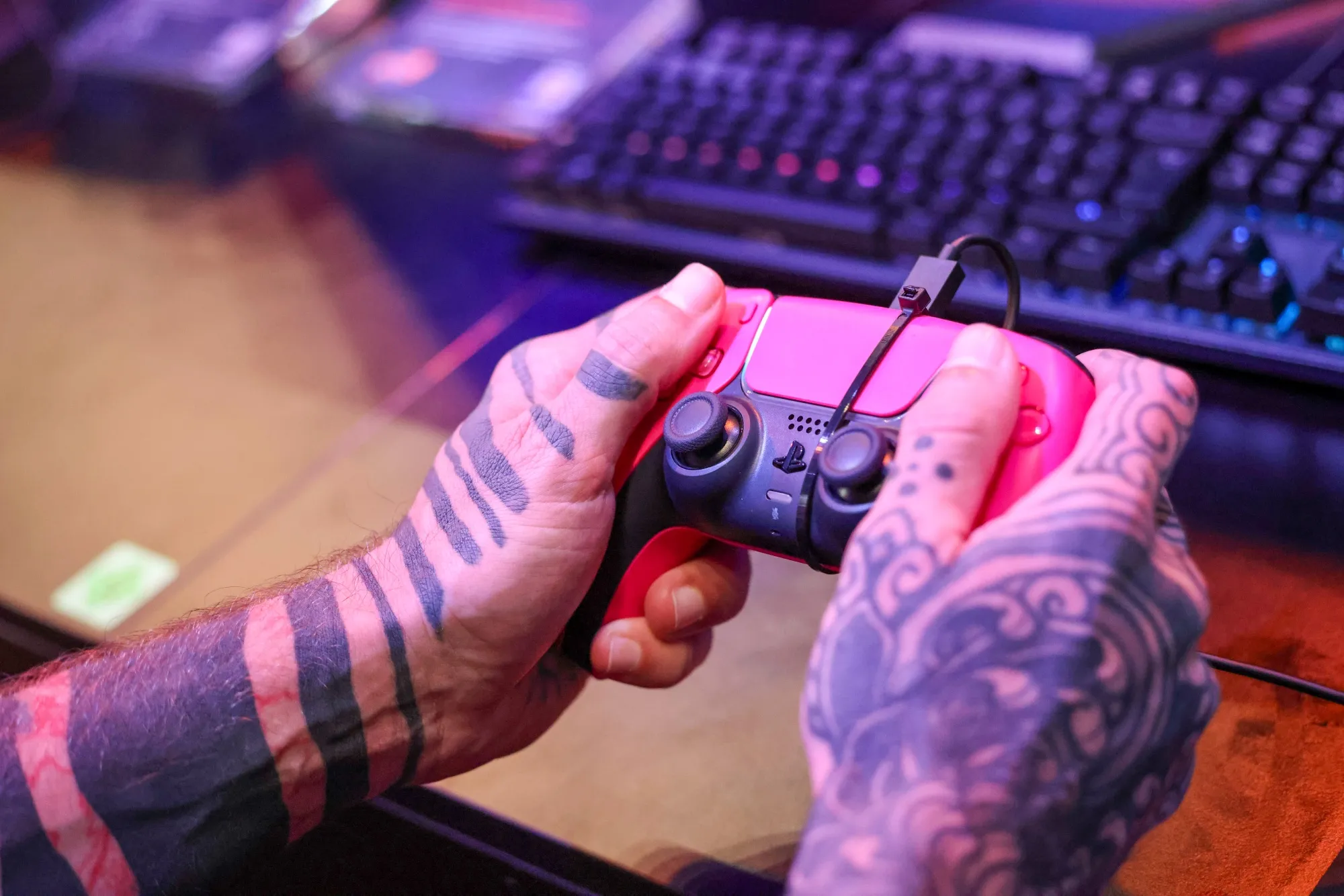 A gamer uses a Sony Corp. Playstation controller at the Gamescon video games trade fair in Cologne, Germany, on Wednesday, Aug. 23, 2023