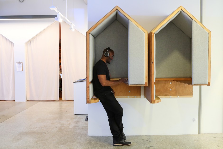 A man works in a nook on his computer at the Airbnb office headquarters in the SOMA district of San Francisco, California, U.S.