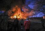 Smoke and flames rise after Russian rockets hit warehouses in the Sviatoshynskyi district of Kyiv on March 17.