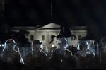 Police line up outside the White House in Washington, D.C. as protests against the killing of George Floyd continue.