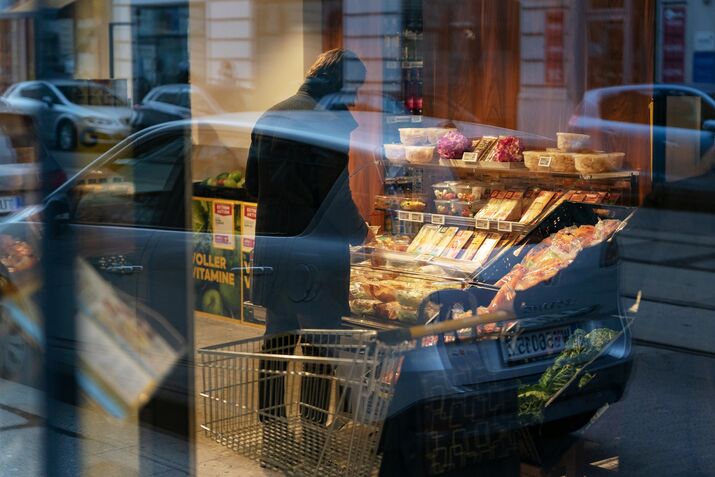 A customer shops for groceries at a supermarket in Vienna.