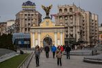 Pedestrians walk through Independence Square in Kiev.&nbsp;