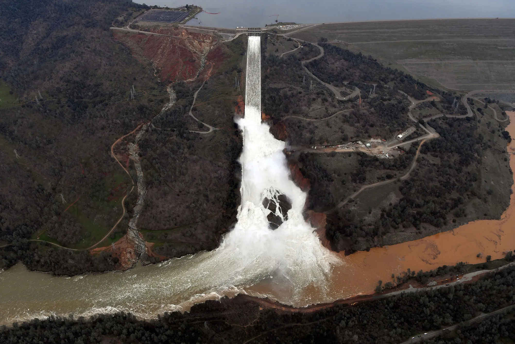 The Oroville Dam spillway releases 100,000 cubic feet of water per second down the main spillway, on Feb. 13.
