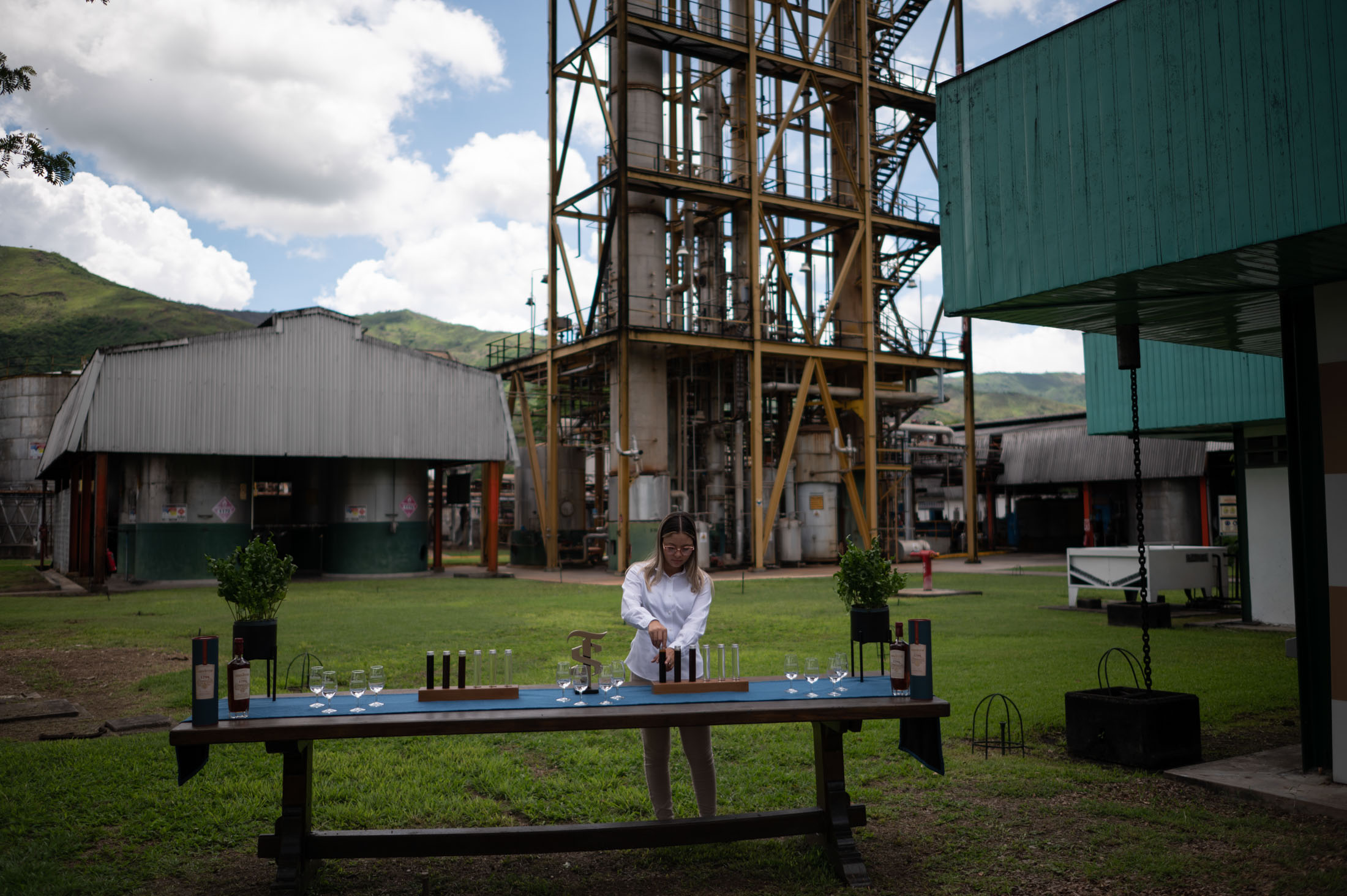 A rum tasting prepared in front of the distilling towers. (Gaby Oraa/Bloomberg)