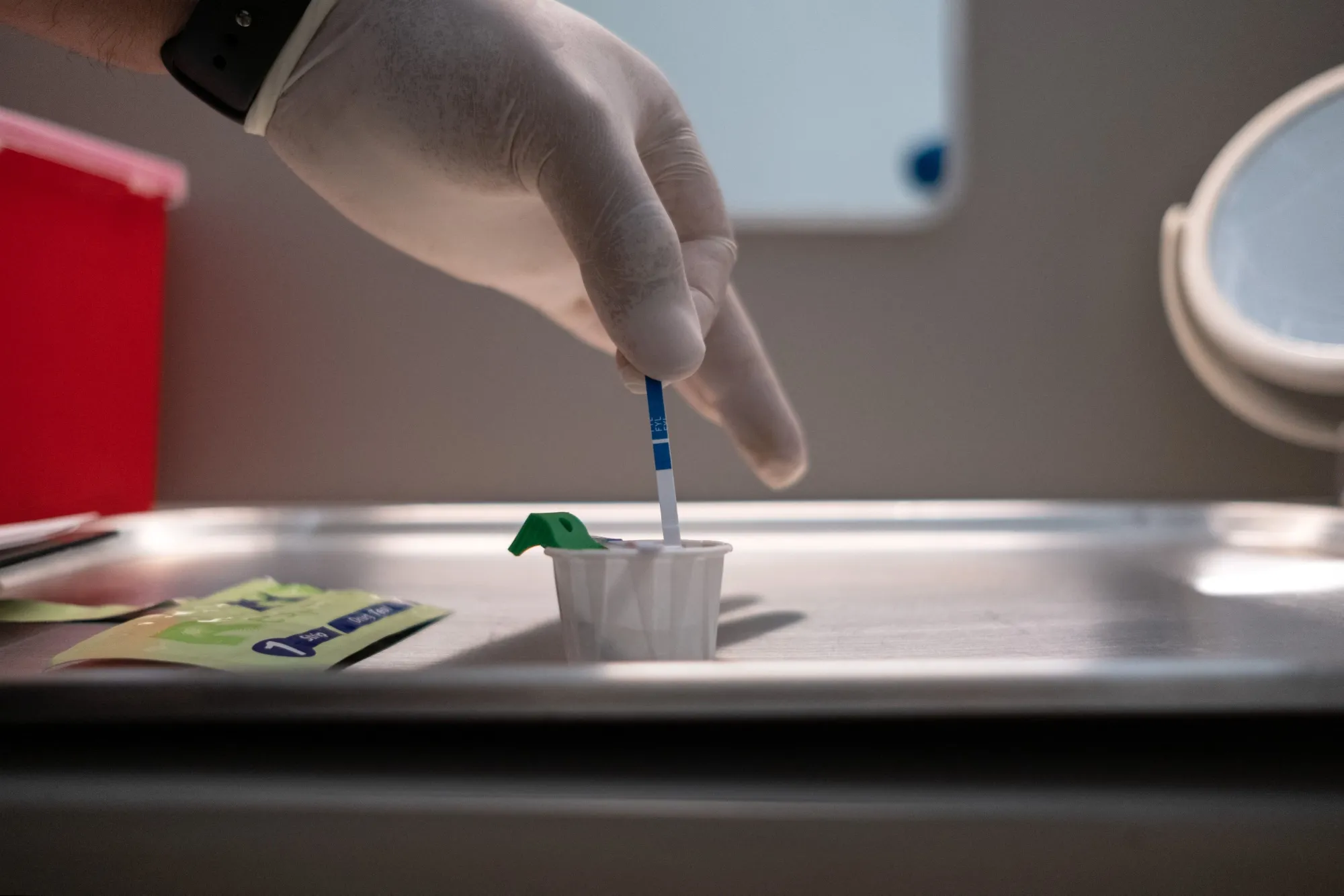 A worker tests a drug sample for&nbsp;fentanyl.