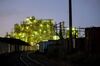 Light is reflected on railway tracks as a chemical plant stands illuminated at night in the Keihin industrial area in Kawasaki, Kanagawa Prefecture, Japan, on Wednesday, July 25, 2018. Japan’s industrial production declined in June for a second-straight month, falling more than expected and adding to concerns that an expected rebound in the economy may not be as strong as hoped.