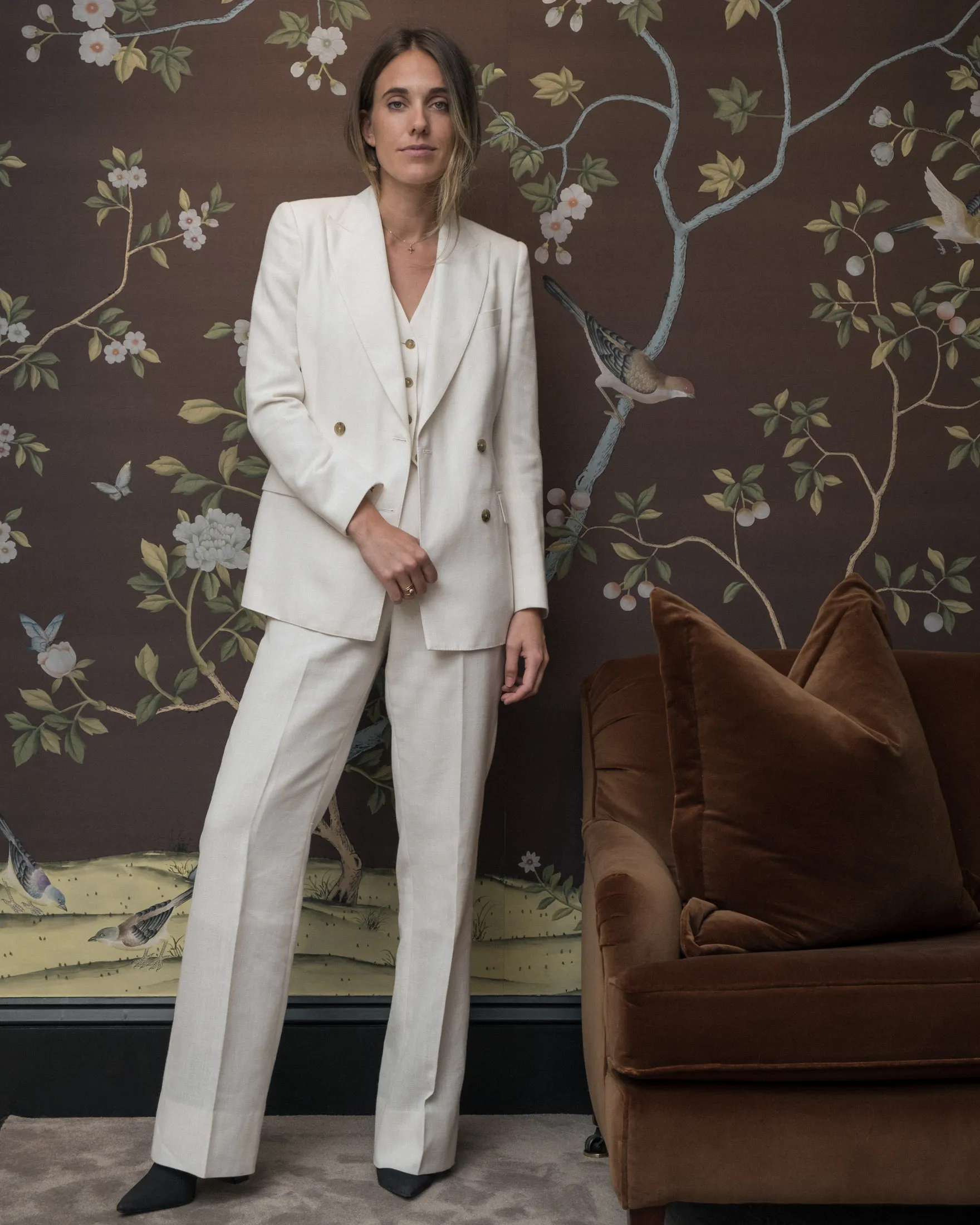 Knatchbull wears a three-piece, made-to-measure suit.