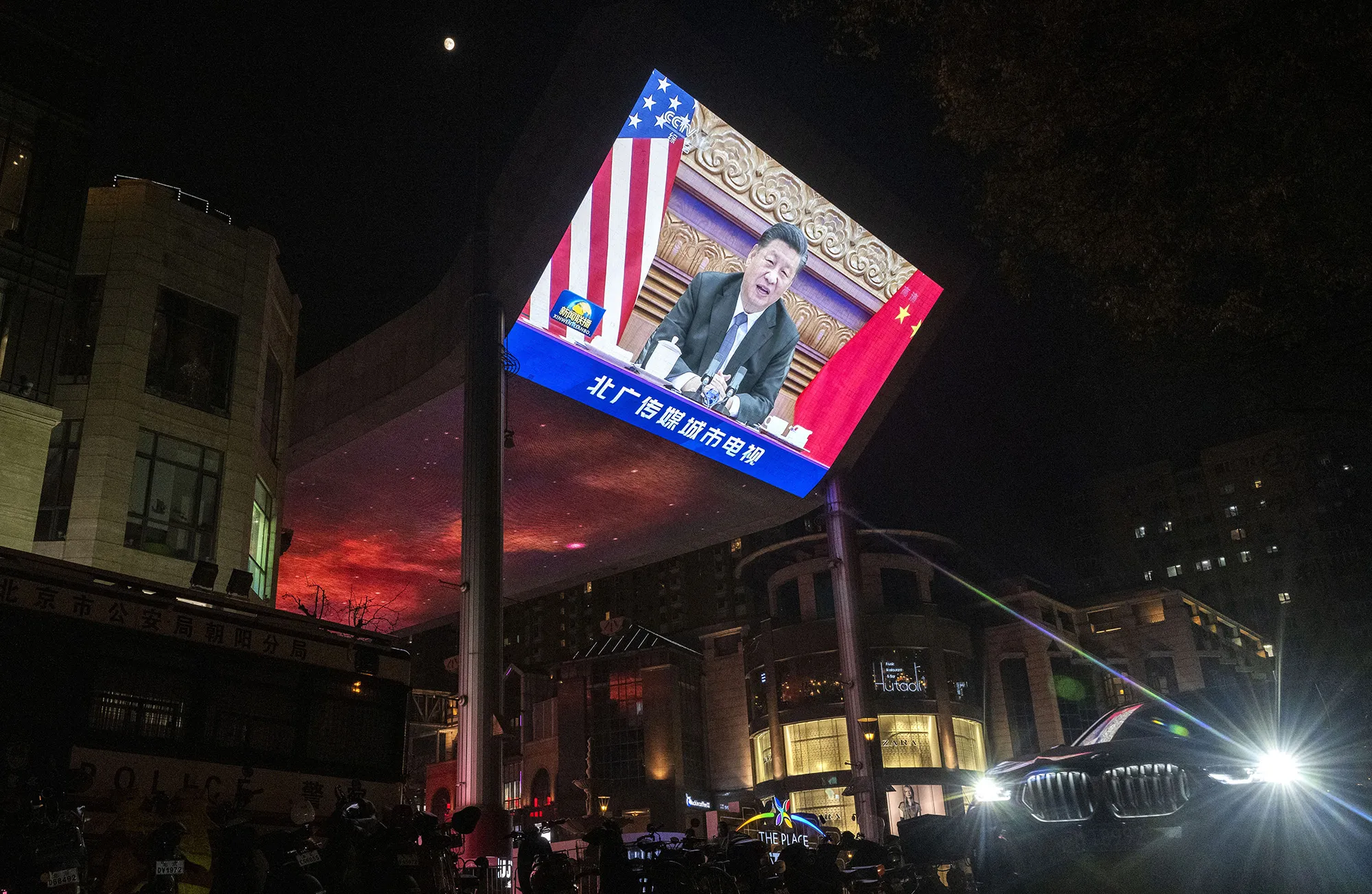 A large screen displays China's President Xi Jinping during a virtual summit with U.S.&nbsp;President Joe Biden, not seen, during the evening CCTV news broadcast outside a shopping mall&nbsp;in Beijing on Nov. 16.&nbsp;
