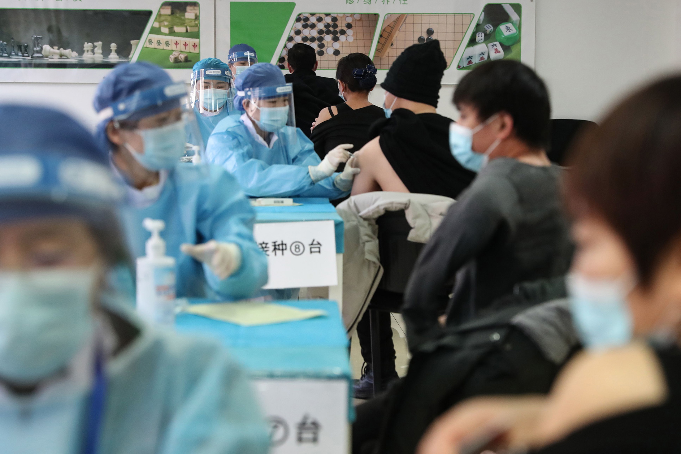 People receive Covid-19 vaccines at a temporary vaccination center in Beijing on January 8.