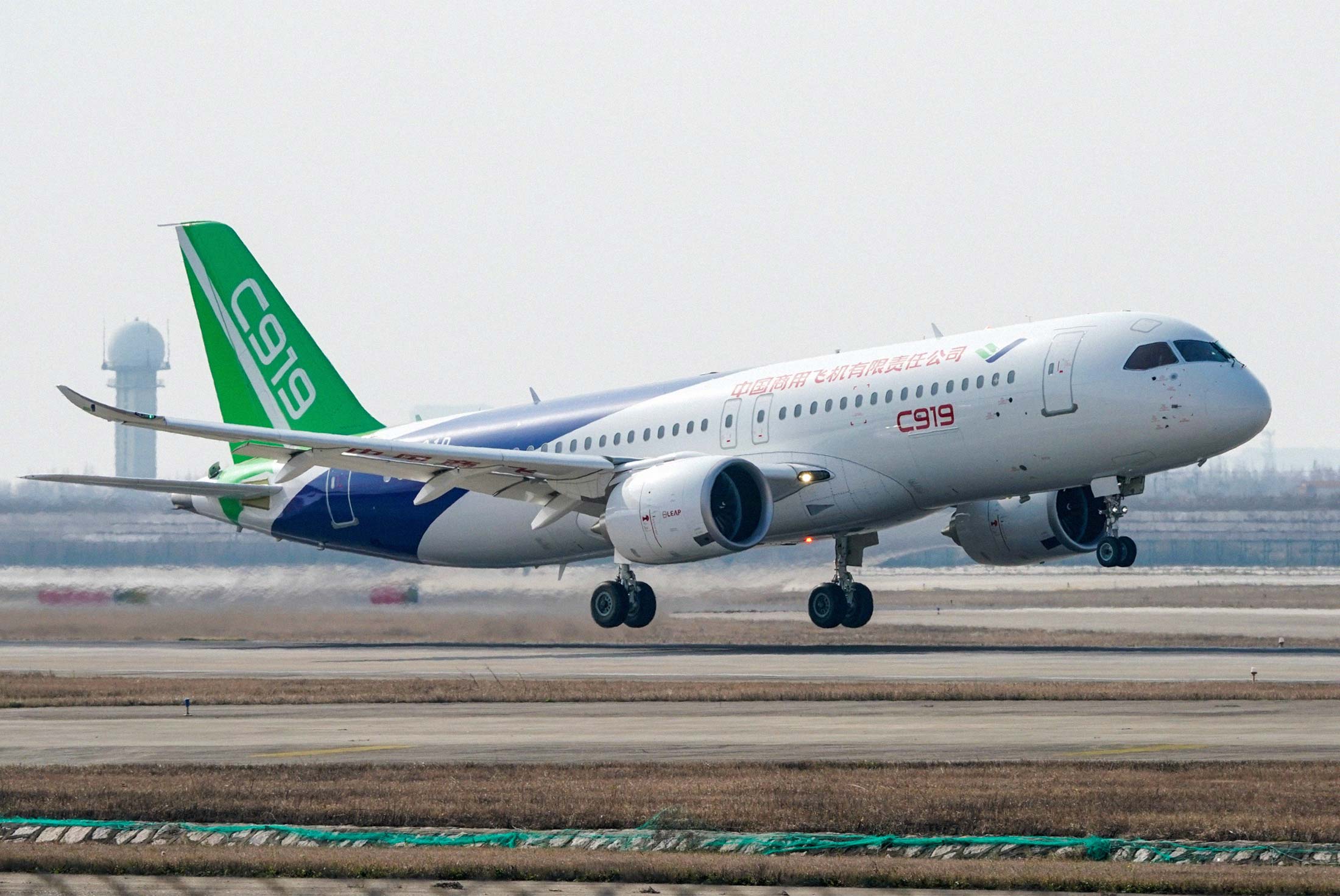 A Comac C919 takes off from Shanghai Pudong International Airport during its maiden flight on Dec. 28, 2018.