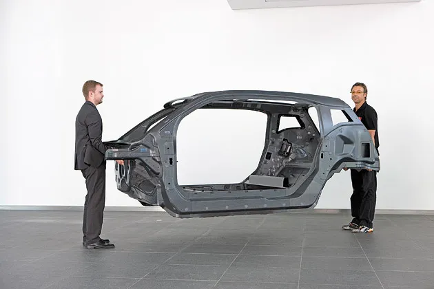 The passenger frame of BMW’s i3 is fashioned from lightweight carbon fiber
