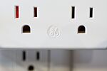 The General Electric Co. logo is displayed on a USB charging station.
