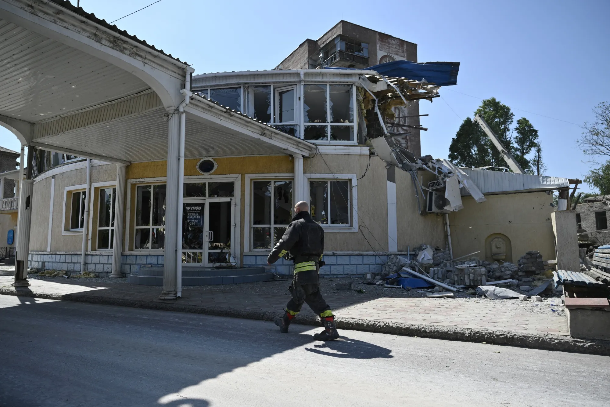 A Ukrainian rescuer walks past a destroyed hotel after a strike in the town of Kramatorsk, Donetsk region on Aug. 25.