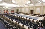 Kim Jong Un, center left, attends a meeting with his senior military officials at an undisclosed location in North Korea on June 21.