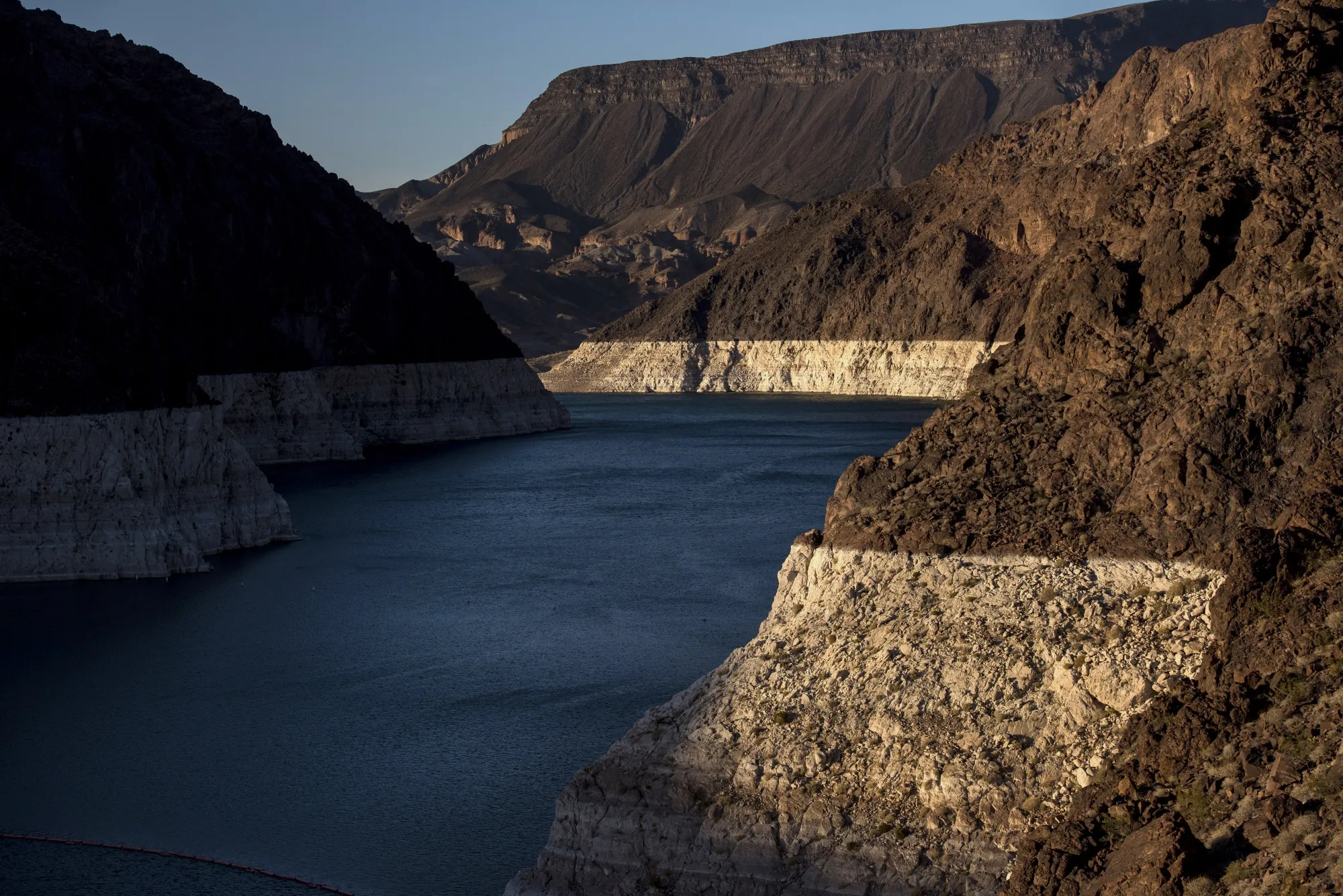 Receding water lines are seen along the shore of Lake Mead in this aerial photograph taken above Boulder City, Nevada, in 2015. The Southern Nevada Water Authority is building a three-mile (five-kilometer), $817 million tunnel under Lake Mead to retain access to its Colorado River supply as the reservoir declines to 40% of capacity.