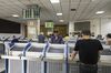 Investors stand in front of trading terminals at a securities brokerage in Shanghai, China, on Wednesday, May 30, 2018. Foreign investors are about to get a bargain. At least, that's the optimistic slant after Chinese equities slumped for the longest stretch since 2013, taking valuations back to two-year lows right before they feature on MSCI Inc. indexes from June 1.