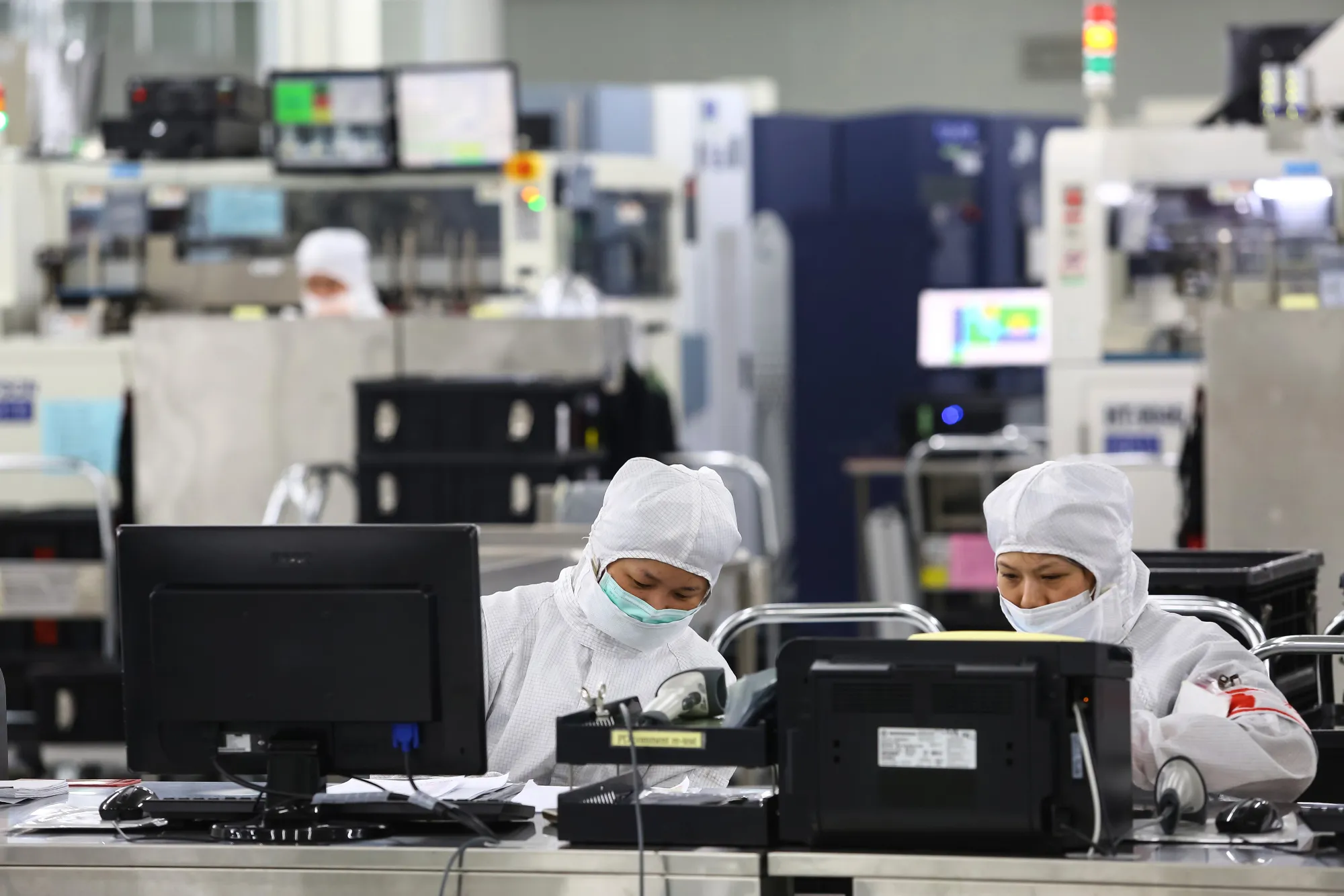 Employees work inside a semiconductor factory&nbsp;in Hsinchu, Taiwan.