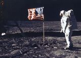 Astronaut Edwin E Aldrin Jr Poses For A Photograph Beside The Deployed Flag Of The United States
