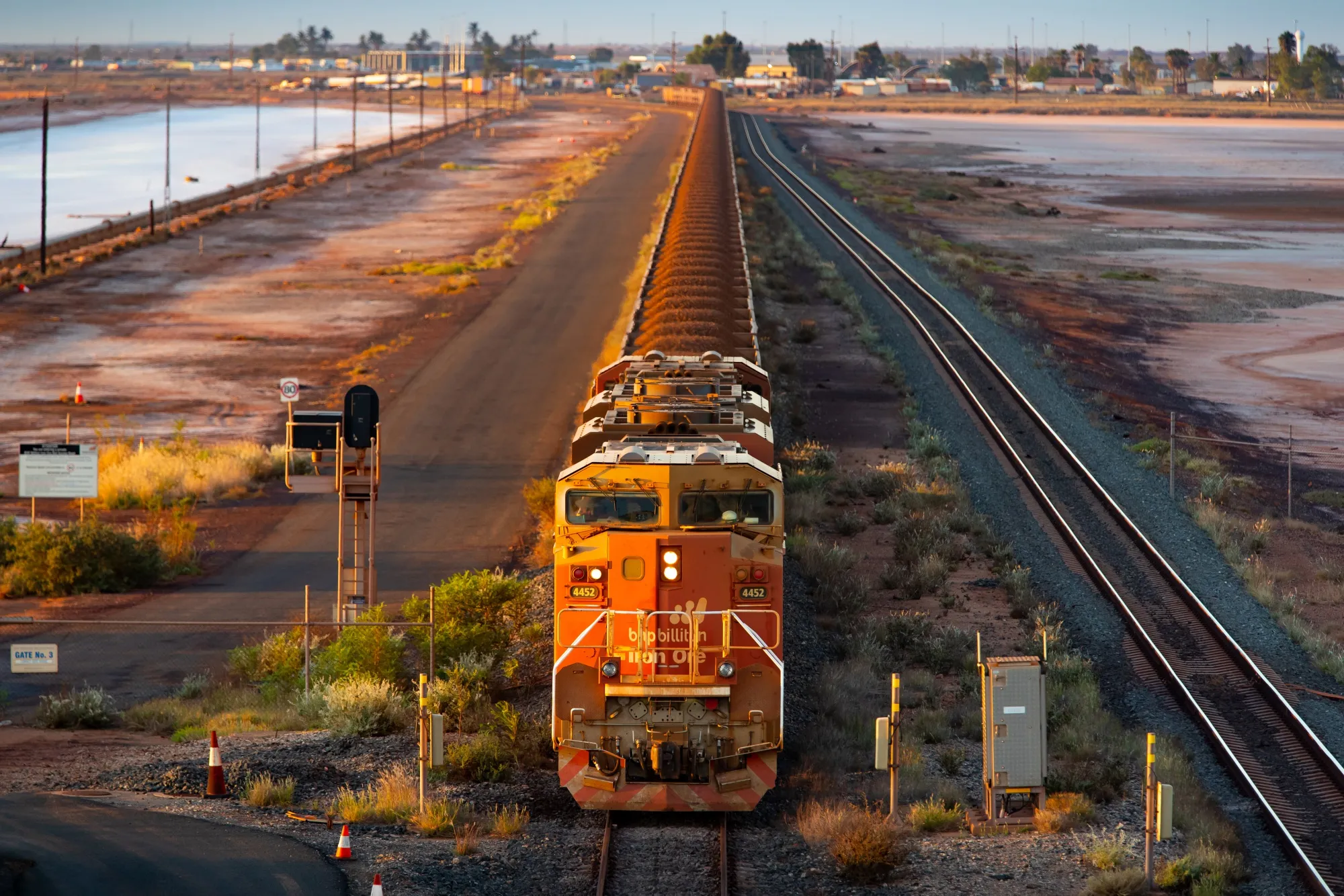 A BHP Group Ltd.&nbsp;freight train carries iron ore&nbsp;towards Port Hedland, Australia.