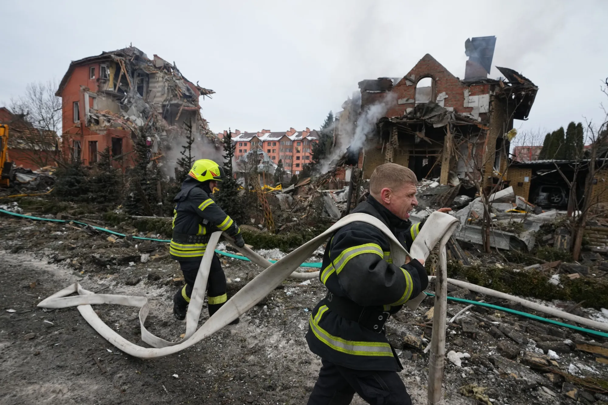 Firefighters tackle a blaze following a Russian air attack in Kyiv, in February.
