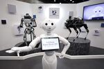 SoftBank's Pepper robot with Boston Dynamics's Atlas and Spot robots.