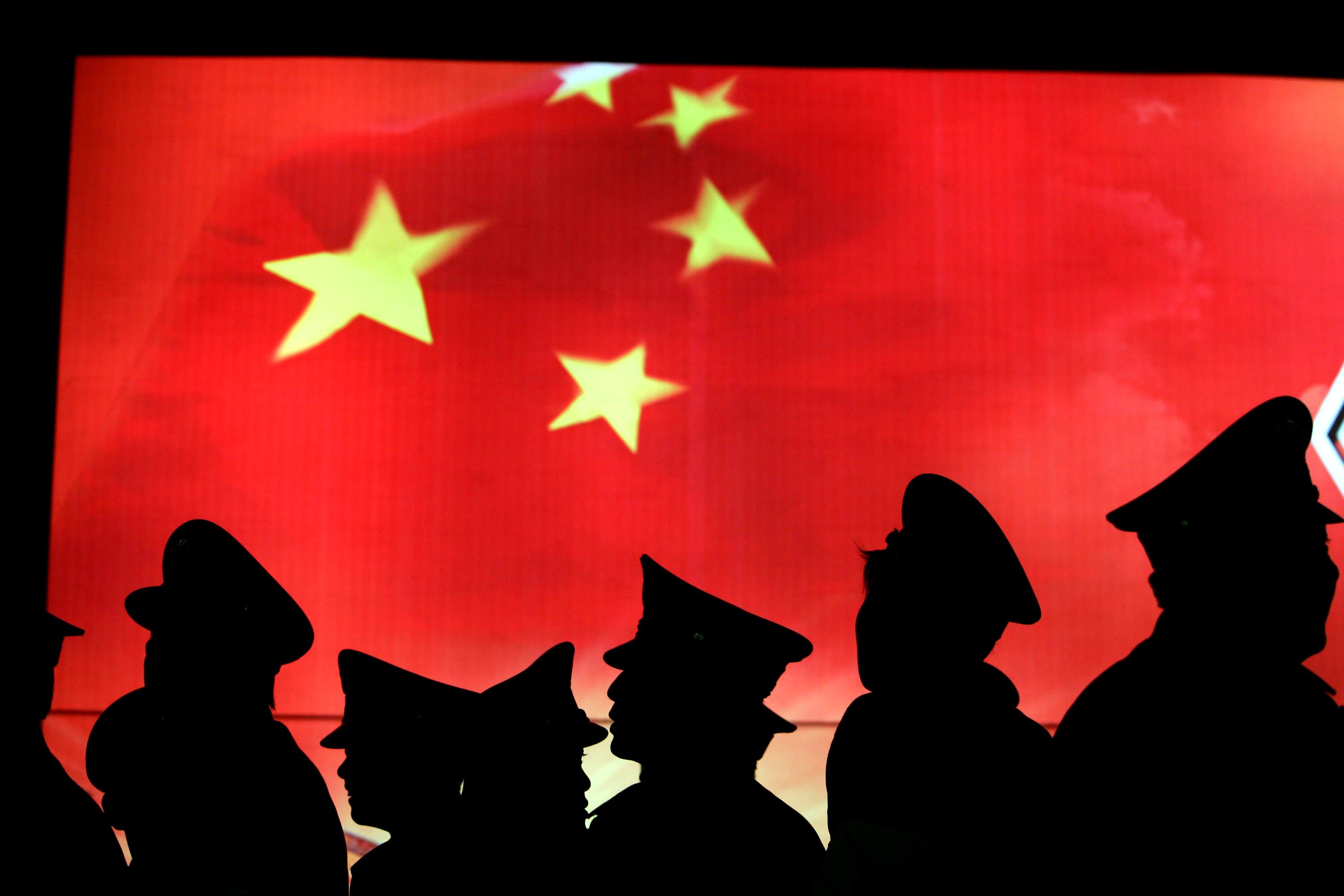 Security guards at the Military Museum of Chinese People's Revolution in Beijing. Photographer: China Photos/Getty Images