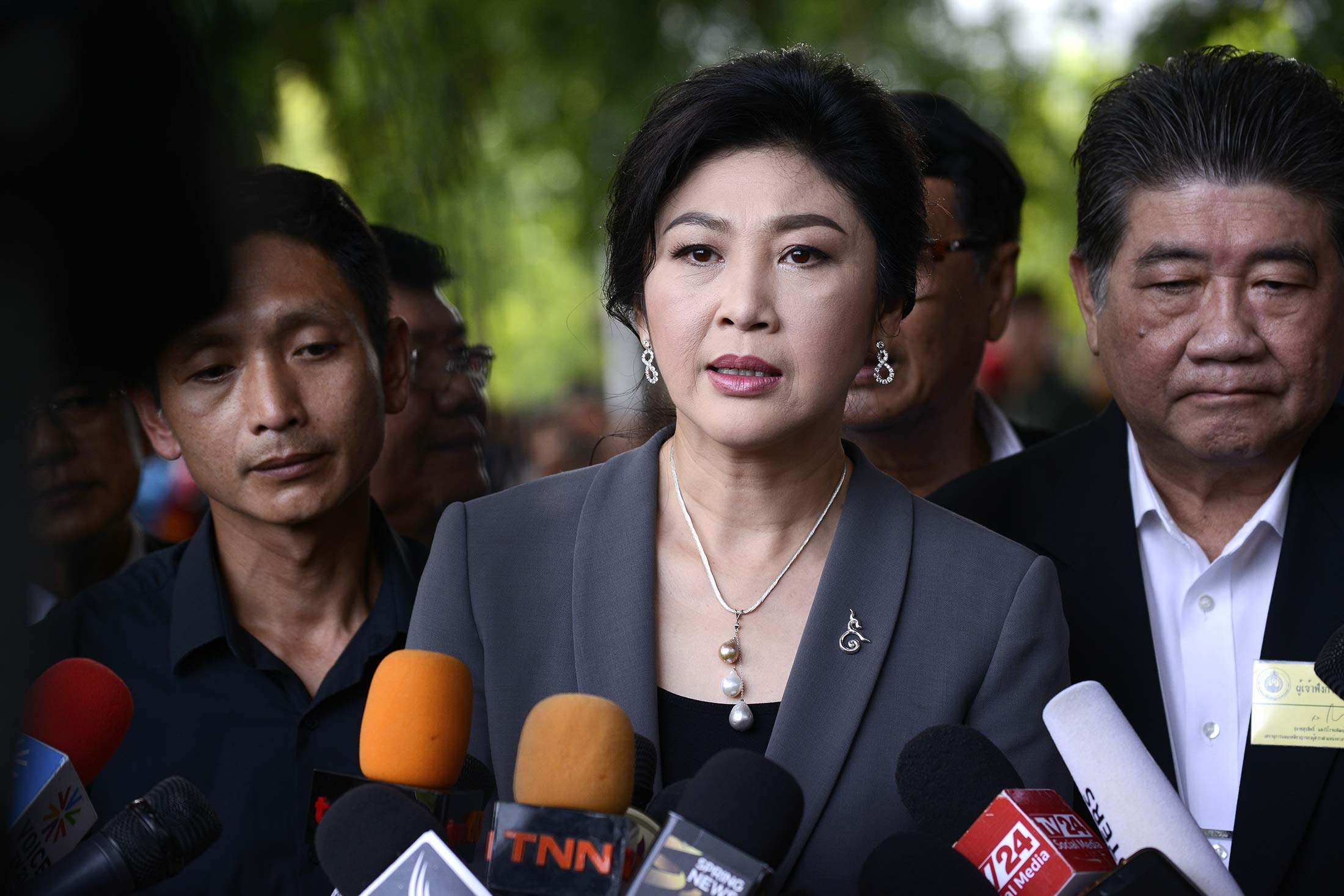 Ousted former Thai Prime Minister Yingluck Shinawatra speaks with members of Thai media as she arrives at the Supreme Court in Bangkok, Thailand on July 7, 2017.
