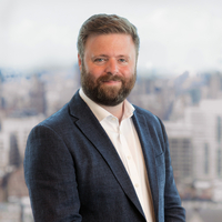 Stylized headshot in Bloomberg office of Dave Lee