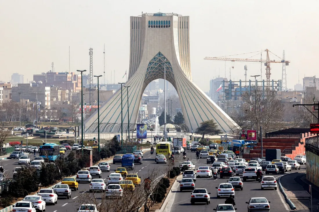 Vehicles move along a highway near Tehran's landmark Azadi&nbsp;Tower in Tehran.
