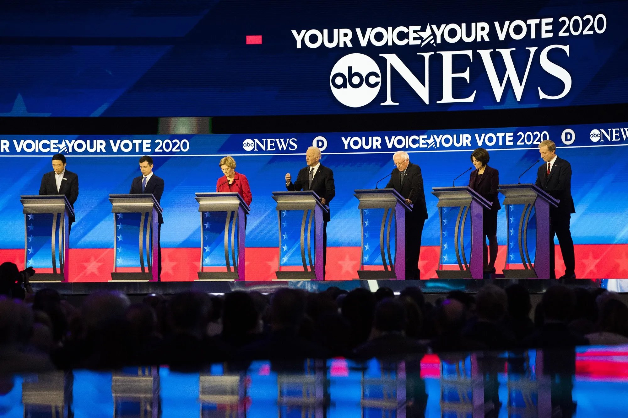 Andrew Yang, from left, Pete Buttigieg, Bernie Sanders, Joe Biden, Elizabeth Warren, Amy Klobuchar and Tom Steyer on Feb. 7.