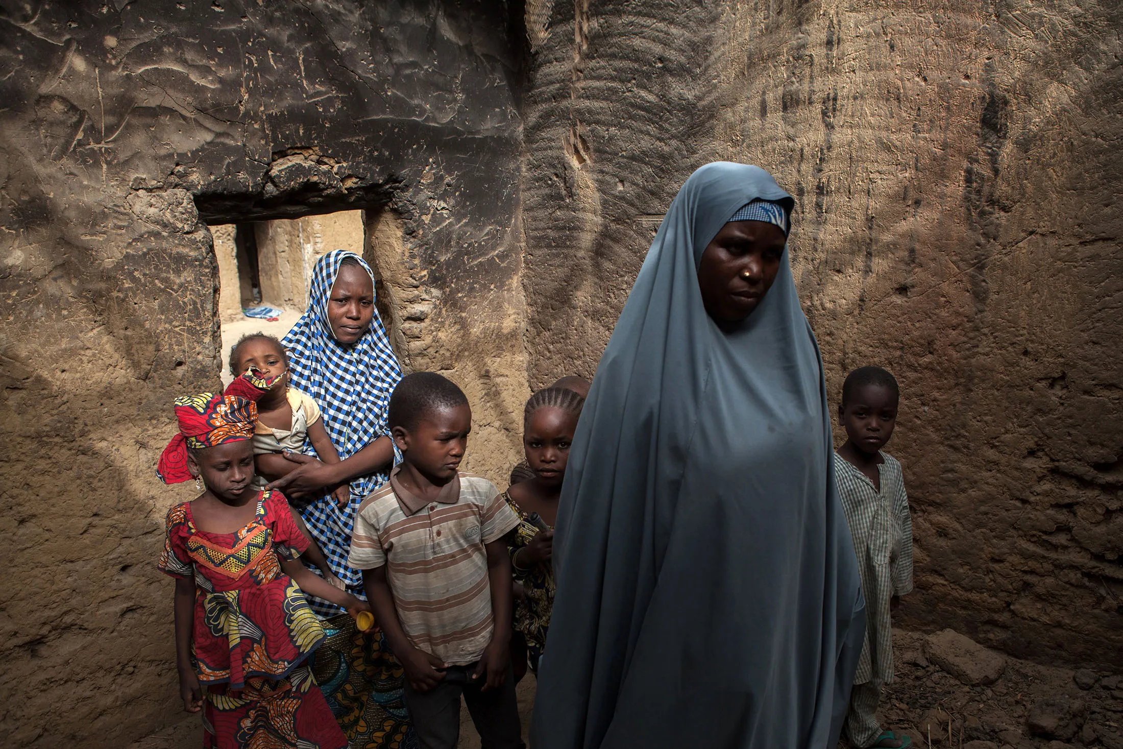 Yagana Bukar and her mother, right, whose two children have been kidnapped by Boko Haram insurgents, are seen at the family home in the town of Damasak in North East Nigeria on April, 25 2017.
