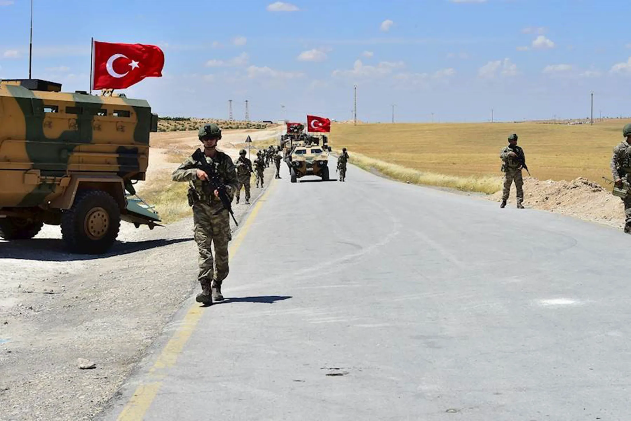 Armoured vehicles and soldiers of Turkish Armed Forces &nbsp;patrol near Manbi.